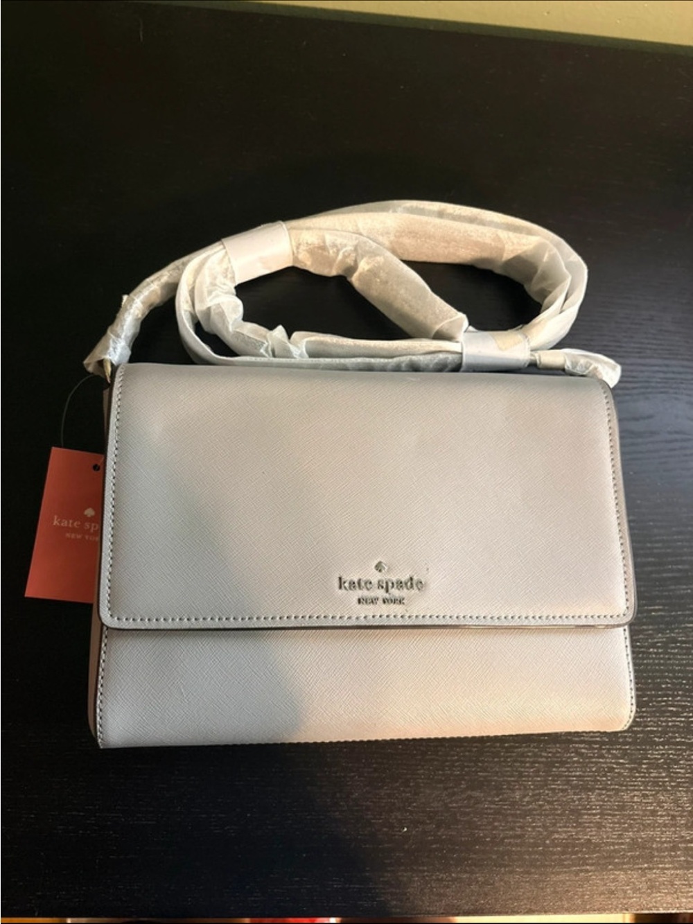 kate spade cream pebbled leather flap crossbody